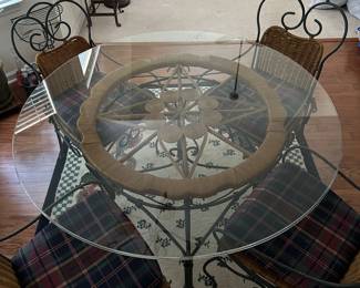 H13 - $125. Glass Top Table is 4' across x 30" tall. Includes 4 Iron framed chairs with cushioned seats. Glass has some minor scratches from use but nothing sharp and no big chips.