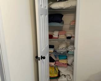 L57 - $10 Linen Closet LOT. Some towels, a couple blankets.