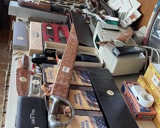 Lots of pocket knives, lighters