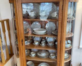 Antique oak bow front china cabinet