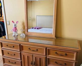 The guy standing on the dresser is performing at this year's Super Bowl.