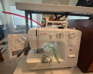 Singer sewing machine with supplies