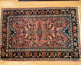 small Persian hand-woven rug