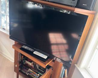 Stereo cabinet and Sony Bravia TV with goodies within