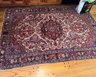 Persian rug, a bit worn on edges but vibrant!