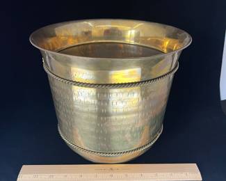 K23 - $20. Brass bucket/planter with brass bow decoration. Measures 8” wide x 8.5” tall.