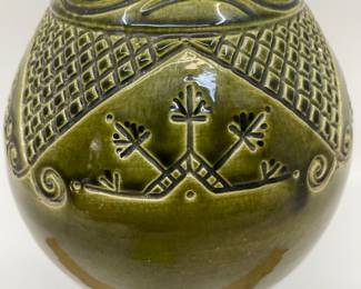 K7 - $35. Vintage olive green vase. Signed. Signed Anna Grandina. Chips on the base. Measures 7”w x 7”d x 10”t.