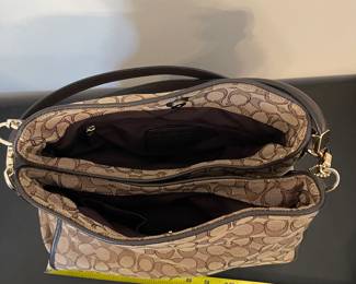 K2 - $45. Coach Signature Phoebe Canvas shoulder bag, in brown/tan. Like new condition. Measures 12”w x 6”d x 10”t.
