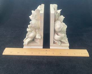 K42 - $20. Vintage White CBK magnolia bookends. Measures 3”w x 5”d x 5.75”t.