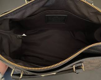 K1 - 75. Coach Morgan Signature Satchel, in dark brown. Like new condition. Measures 14w x 6”d x 9”t.