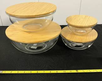 S29 - $40. Crate & Barrel 4 Nesting Glass Mixing Bowls with Bamboo Lids.