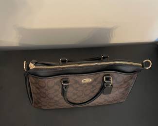 K1 - 75. Coach Morgan Signature Satchel, in dark brown. Like new condition. Measures 14w x 6”d x 9”t.