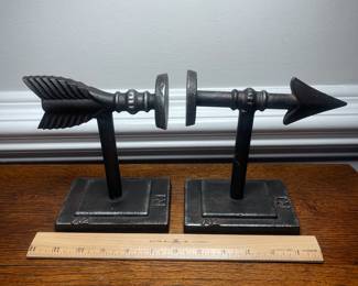 K41 - $25. Cast iron arrow bookends.