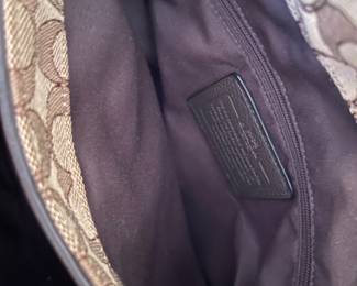 K2 - $45. Coach Signature Phoebe Canvas shoulder bag, in brown/tan. Like new condition. Measures 12”w x 6”d x 10”t.