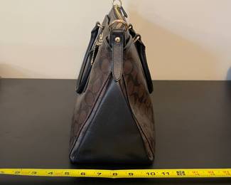 K1 - 75. Coach Morgan Signature Satchel, in dark brown. Like new condition. Measures 14w x 6”d x 9”t.