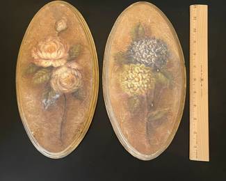 K21 - $20. Pair of vintage floral wall plaques featuring textured hydrangea and rose art. Each Measures 6”w x 12”t.