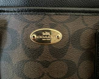 K1 - 75. Coach Morgan Signature Satchel, in dark brown. Like new condition. Measures 14w x 6”d x 9”t.