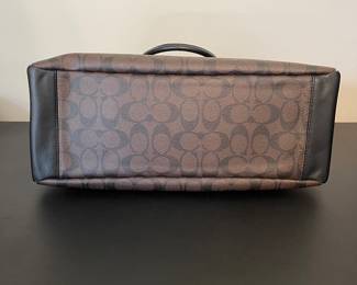 K1 - 75. Coach Morgan Signature Satchel, in dark brown. Like new condition. Measures 14w x 6”d x 9”t.