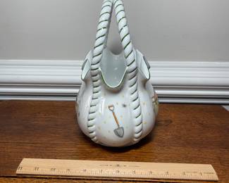 K44 - $35. Signed Handpainted USA ceramic basket with bees and honey motif. Measures 7”w x 5”d x 10”t.