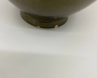 K7 - $35. Vintage olive green vase. Signed. Signed Anna Grandina. Chips on the base. Measures 7”w x 7”d x 10”t.