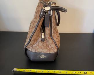 K2 - $45. Coach Signature Phoebe Canvas shoulder bag, in brown/tan. Like new condition. Measures 12”w x 6”d x 10”t.