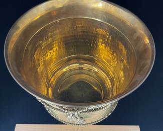 K23 - $20. Brass bucket/planter with brass bow decoration. Measures 8” wide x 8.5” tall.