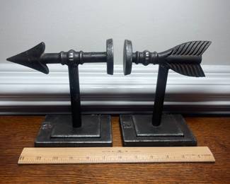 K41 - $25. Cast iron arrow bookends.