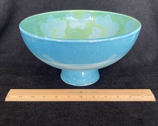 K47 - $30. Vietri Ceramic Italian pedestal bowl with blue and green design. Measures 12”w x 5.75”t.
