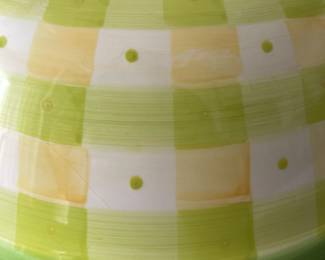 K48 - $25. Large vintage bowl. Designed by Tracy Porter and hand painted. Fun green and yellow checkered design with pink flowers. Some crazing on the underside. Measures 14”w x 5”t.