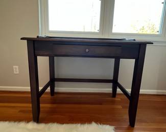 B4 - $50. Small Desk with single drawer. Measures 38" x 24" x 33.25". Pressed wood - very good condition with just a few marks on the top.