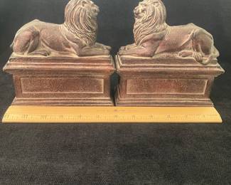 K43 - $45. Cast metal/bronze Lion bookends Measures each 6”w x 2.5”d x 6”t .