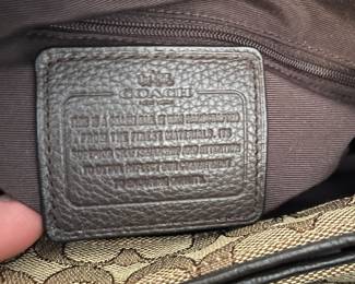 K2 - $45. Coach Signature Phoebe Canvas shoulder bag, in brown/tan. Like new condition. Measures 12”w x 6”d x 10”t.