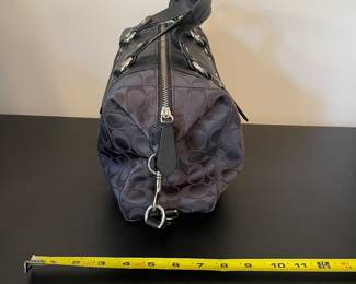 K4 - $45. Coach Ashley Signature black canvas handbag with leather trim, in black. Excellent condition. Measures 11.5”w x 4.5”d x 7”t.