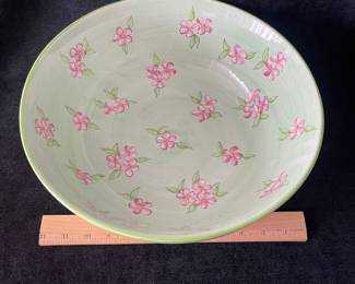 K48 - $25. Large vintage bowl. Designed by Tracy Porter and hand painted. Fun green and yellow checkered design with pink flowers. Some crazing on the underside. Measures 14”w x 5”t.