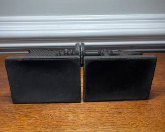 K41 - $25. Cast iron arrow bookends.
