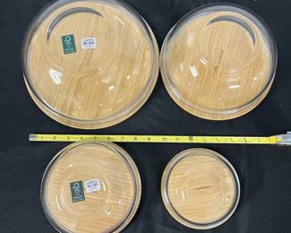 S29 - $40. Crate & Barrel 4 Nesting Glass Mixing Bowls with Bamboo Lids.