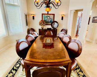 Dining table with 10 chairs (8 side and 2 arm) set includes 2 leaves ( ") Table size with no leave measures l