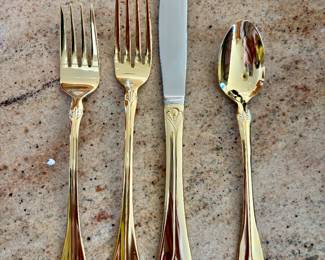 Gold flatware- 4 piece place settings-8 Place settings plus extras and a meat fork 