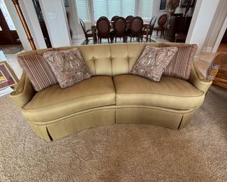 We have a pair of curved sofas manufactured by Thomasville. Button back and exquisite arm detail. Fabric is a tone on tone stripe.