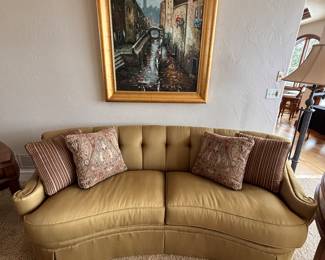 We have a pair of curved sofas manufactured by Thomasville. Button back and exquisite arm detail. Fabric is a tone on tone stripe.