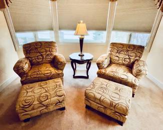 Pair of upholstered occasional chairs with matching ottomans