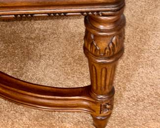 Details of leg on upholstered bench