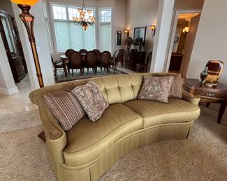 We have a pair of curved sofas manufactured by Thomasville. Button back and exquisite arm detail. Fabric is a tone on tone stripe.