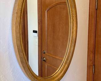 Oval mirror with wood frame
