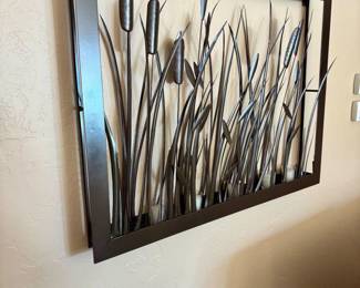 Metal wall art with votive holders at base