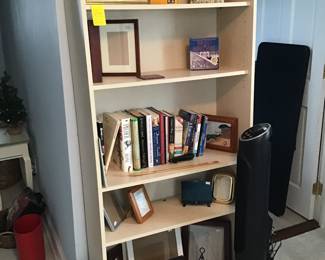 Bookcase, books, frames, etc.