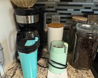 Assorted Kitchenware and Baking Supplies including Bamboo Organizer, Coffee Maker, Cast Iron Skillet, Le Creuset Pot, and Muffin Tins fifth image