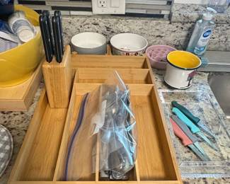Assorted Kitchenware and Baking Supplies including Bamboo Organizer, Coffee Maker, Cast Iron Skillet, Le Creuset Pot, and Muffin Tins