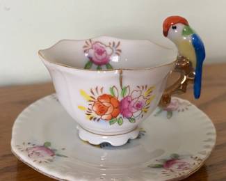 Miniature teacup with parrot