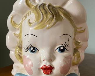 A vintage Hull USA ceramic bonnet baby face head vase/planter 